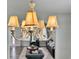 Elegant chandelier in warm lighting, complementing the home's interior design at 1861 Remembrance Ave, St Cloud, FL 34769