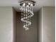 Close-up of a modern crystal chandelier in a hallway niche at 1861 Remembrance Ave, St Cloud, FL 34769