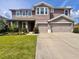 Charming two-story home with landscaped front yard and a two-car garage offers curb appeal at 1861 Remembrance Ave, St Cloud, FL 34769