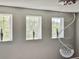 Bright interior showcasing decorative vases in windows and a modern chandelier at 1861 Remembrance Ave, St Cloud, FL 34769