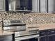 Close-up of stainless steel appliances and granite countertops, blending style and functionality at 1861 Remembrance Ave, St Cloud, FL 34769