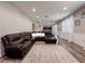 Expansive living room showcasing a modern fireplace and an open-concept layout at 1861 Remembrance Ave, St Cloud, FL 34769