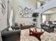 Spacious living room featuring soaring ceilings, elegant decor, and comfortable seating arrangements at 1861 Remembrance Ave, St Cloud, FL 34769