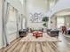 Inviting living room with soaring ceilings, elegant decor, and abundant natural light at 1861 Remembrance Ave, St Cloud, FL 34769