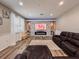 Cozy living room with modern fireplace and comfortable leather seating at 1861 Remembrance Ave, St Cloud, FL 34769