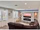 Comfortable living room with modern electric fireplace and abundant natural light at 1861 Remembrance Ave, St Cloud, FL 34769