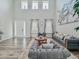 Bright living room featuring soaring ceilings, stylish decor, and comfortable seating area at 1861 Remembrance Ave, St Cloud, FL 34769