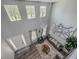 Spacious living room featuring a high ceiling, modern chandelier, and stylish decor at 1861 Remembrance Ave, St Cloud, FL 34769