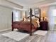 Elegant main bedroom featuring a luxurious four-poster bed and decor at 1861 Remembrance Ave, St Cloud, FL 34769