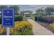 Entrance to Sunset Park with a paved path leading to a gazebo at 1861 Remembrance Ave, St Cloud, FL 34769