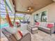 Spacious covered patio with wicker furniture, hammocks, and view of the backyard at 1861 Remembrance Ave, St Cloud, FL 34769