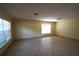 Bright and spacious living room showcasing neutral tile floors and large windows at 2007 Country Brook Ave, Clermont, FL 34711