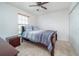 Inviting bedroom featuring ceiling fan, closet, and good natural light at 212 Primrose Dr, Davenport, FL 33837