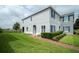 Beautiful two-story home with a well-manicured lawn, brick walkway, and picturesque landscaping at 212 Primrose Dr, Davenport, FL 33837