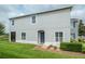 Charming two-story home with a well-maintained lawn and inviting front entrance at 212 Primrose Dr, Davenport, FL 33837