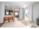 Inviting foyer leading into a well-lit home with tiled floors and an open layout at 212 Primrose Dr, Davenport, FL 33837