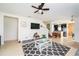 Comfortable living room featuring tiled floors and an open concept design leading to the kitchen at 212 Primrose Dr, Davenport, FL 33837