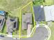 An aerial view of a well maintained single-Gathering home showcasing its brick paved driveway and manicured lawn at 2147 Timber Creek Ln, Clermont, FL 34715