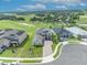 A stunning aerial view of a modern home featuring a brick paved driveway, lush landscaping and a large lot at 2147 Timber Creek Ln, Clermont, FL 34715