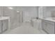 Spa-like bathroom features a walk-in shower, soaking tub, double vanity, and tile floors at 2147 Timber Creek Ln, Clermont, FL 34715