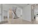 Spacious foyer with tiled flooring, staircase, and entrances to other rooms at 2147 Timber Creek Ln, Clermont, FL 34715