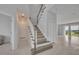 Open foyer featuring a carpeted staircase, tiled floors, and access to various rooms at 2147 Timber Creek Ln, Clermont, FL 34715