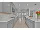 Modern kitchen featuring stainless steel appliances and herringbone backsplash at 2147 Timber Creek Ln, Clermont, FL 34715
