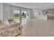 Open floor plan with tile flooring, patio doors, and connected kitchen and dining areas at 2147 Timber Creek Ln, Clermont, FL 34715