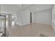 Spacious living space with tile flooring, neutral paint and view to the backyard at 2147 Timber Creek Ln, Clermont, FL 34715