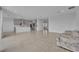 Spacious open-concept living room and kitchen with modern appliances and sleek countertops at 2147 Timber Creek Ln, Clermont, FL 34715