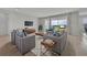 Comfortable living room with modern furniture, plush rug, and beautiful outdoor views at 2147 Timber Creek Ln, Clermont, FL 34715