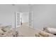Inviting room featuring comfortable couches and a clear view through the glass paneled doorway at 2147 Timber Creek Ln, Clermont, FL 34715