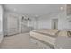 Bright main bedroom features neutral tones, carpet floors, and ample space for furniture at 2147 Timber Creek Ln, Clermont, FL 34715