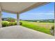 Covered patio offers a serene outdoor space with picturesque views of the lush, rolling landscape at 2147 Timber Creek Ln, Clermont, FL 34715