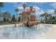 A fun water park featuring a play structure with slides and climbing nets, perfect for Gathering entertainment and relaxation at 2147 Timber Creek Ln, Clermont, FL 34715