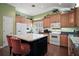Well-lit kitchen with island and lots of cabinet space at 215 Chula Vista Ave, The Villages, FL 32159