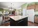 Spacious open kitchen featuring a large island and modern appliances at 215 Chula Vista Ave, The Villages, FL 32159
