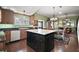 Large kitchen with island, dining area, and open to the living room at 215 Chula Vista Ave, The Villages, FL 32159