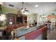 Spacious living room with hardwood floors, open floor plan, and media center at 215 Chula Vista Ave, The Villages, FL 32159