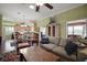 Spacious living room with hardwood floors, open floor plan, and views of the kitchen at 215 Chula Vista Ave, The Villages, FL 32159