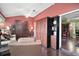 Comfortable sunroom with hardwood floors, vaulted ceiling, and ample storage at 215 Chula Vista Ave, The Villages, FL 32159