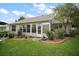 Cozy sun room is part of this single-Gathering home with large windows and access to a beautiful landscaped yard at 215 Chula Vista Ave, The Villages, FL 32159