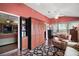 Bright sunroom with hardwood floors, built-in cabinets, and cozy furniture at 215 Chula Vista Ave, The Villages, FL 32159