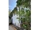 Exterior side view of home featuring mature trees, siding and an unfinished foundation at 220 E Woodward Ave, Eustis, FL 32726