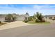 Well-maintained home with a two-car garage, landscaped front yard, and inviting curb appeal at 2312 Nackman Pl, The Villages, FL 32162