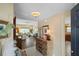Inviting foyer showcasing hardwood floors and a glimpse of the spacious living area at 2312 Nackman Pl, The Villages, FL 32162