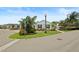 Charming home with well-maintained lawn and landscaping on a corner lot, showcasing curb appeal and community setting at 2312 Nackman Pl, The Villages, FL 32162