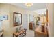 Bright hallway with neutral decor and a glimpse of the living area at 2312 Nackman Pl, The Villages, FL 32162