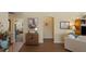 Comfortable living room featuring hardwood floors, neutral decor, and an open floor plan at 2312 Nackman Pl, The Villages, FL 32162