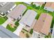 Aerial view of a residential home with a well-maintained roof and backyard at 2317 Whisper St, The Villages, FL 32162